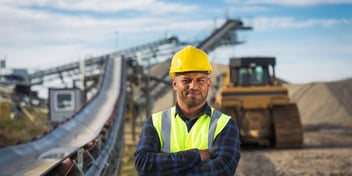 Worker in yellow hat on constructions site